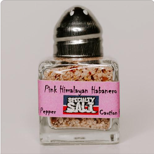 Pink Himalayan Habanero salt in a glass grinder jar
